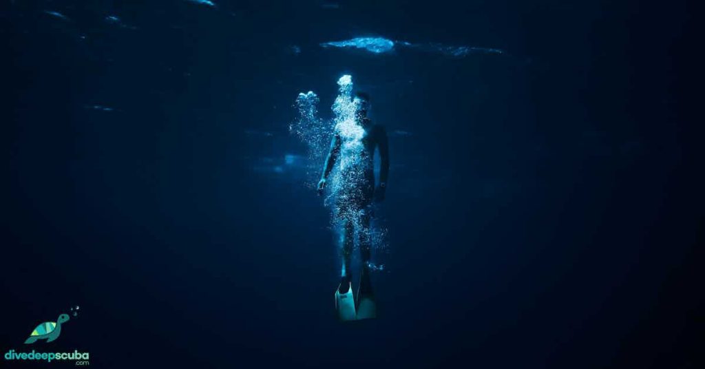 Freediver swimming up to the surface
