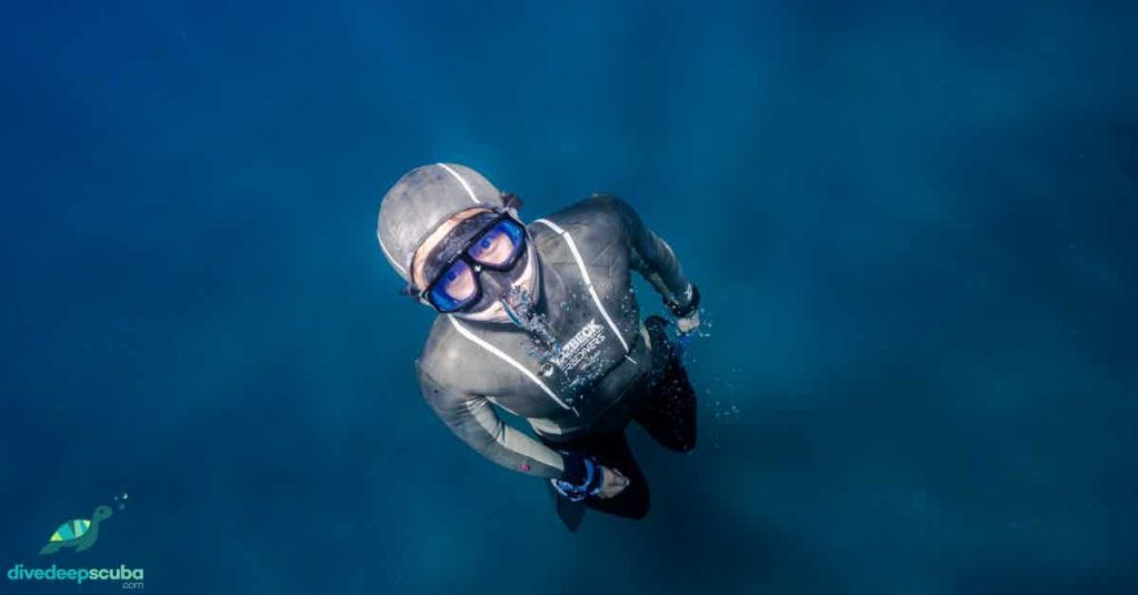 Freediver swimming up to the surface