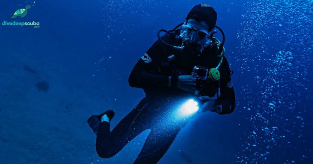 Scuba diver with a torch