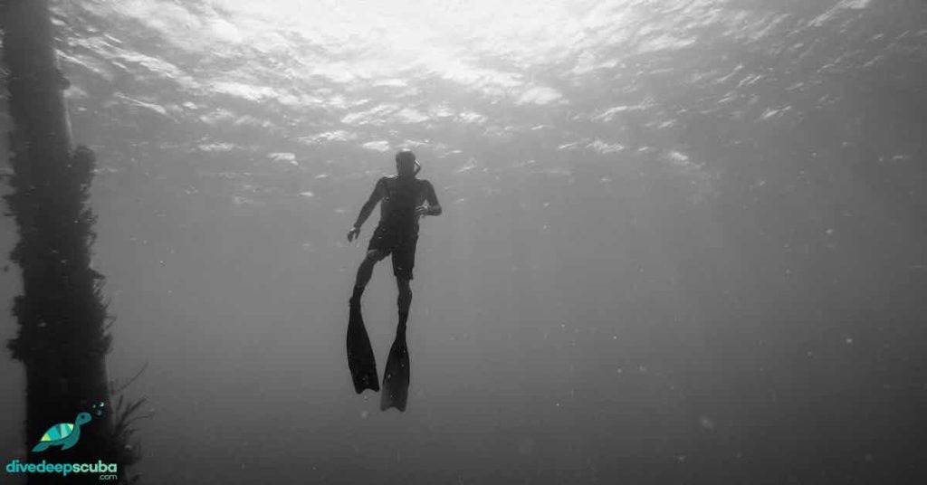 Freediver swimming up to the surface