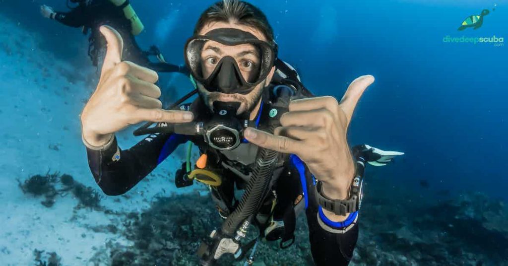 Scuba diver showing "awesome\" hand signal