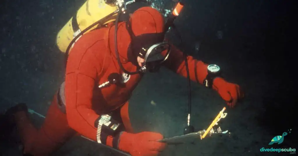 Deep sea diver reading a slate