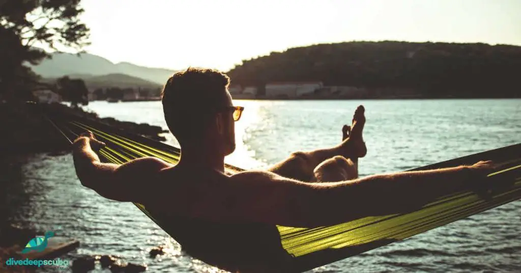 man relaxing in a hammock