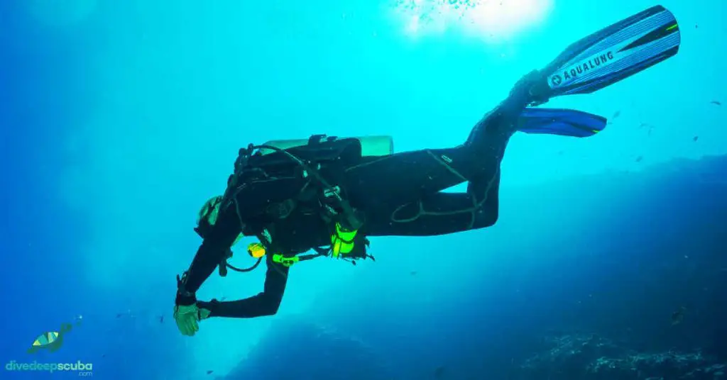 Scuba diver in perfect trim from below