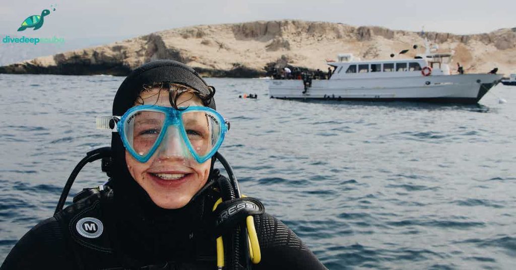 Scuba diver smiling on the boat