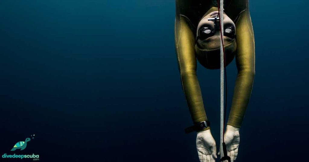 Freediver descending on a line